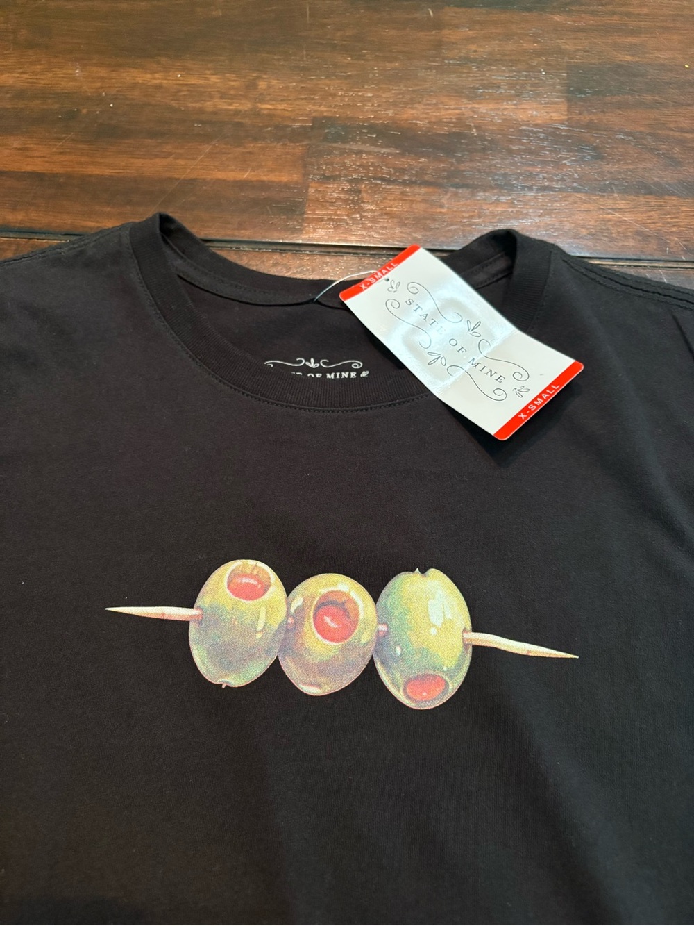 State of Mine Black olive t-shirt with three olives on a skewer graphic